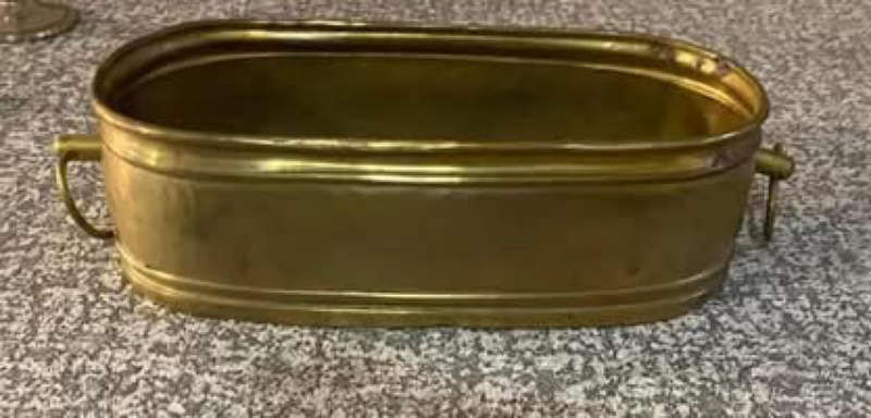 Antique brass tub planter