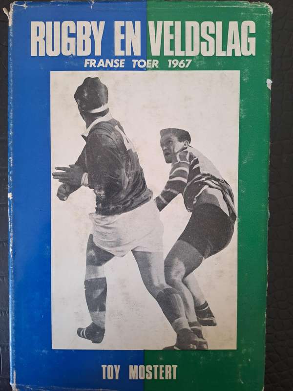 Rugby book. "Rugby en Veldslag" by Toy Mostert h/c with d/w 116 pp French tour to SA 1967