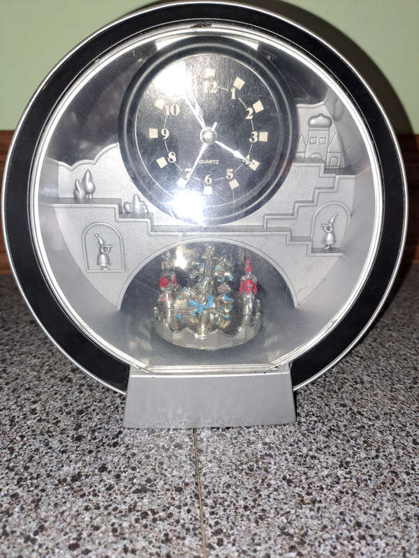 Quartz merry go round clock