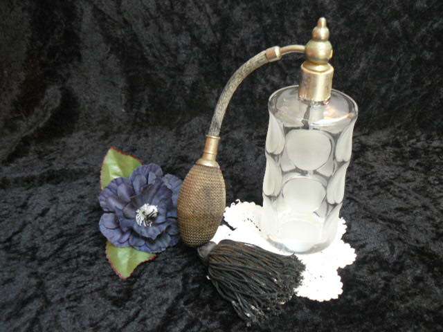 ANTIQUE PERFUMEGLASS DISPENSOR....REFILLABLE WITH TASSEL HEAVY AND NICE PATTERN