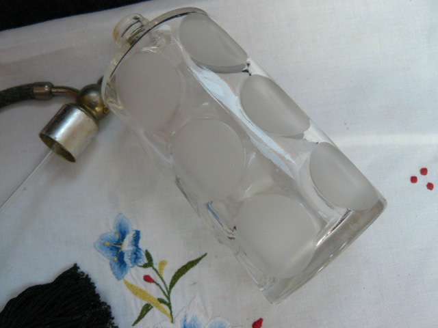 ANTIQUE PERFUMEGLASS DISPENSOR....REFILLABLE WITH TASSEL HEAVY AND NICE PATTERN