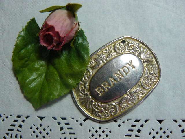 SILVER PLATED ENGLAND BRANDY BOTTLE LABLE STAMPED