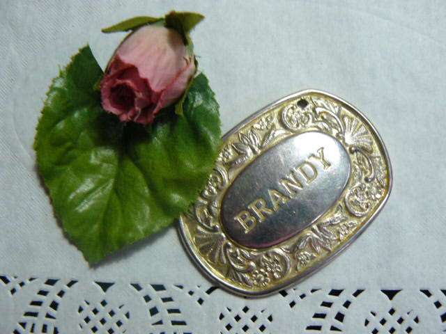 SILVER PLATED ENGLAND BRANDY BOTTLE LABLE STAMPED
