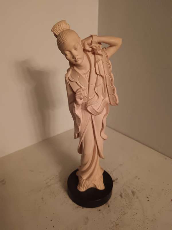 Asian Lady Figurine on a black Base