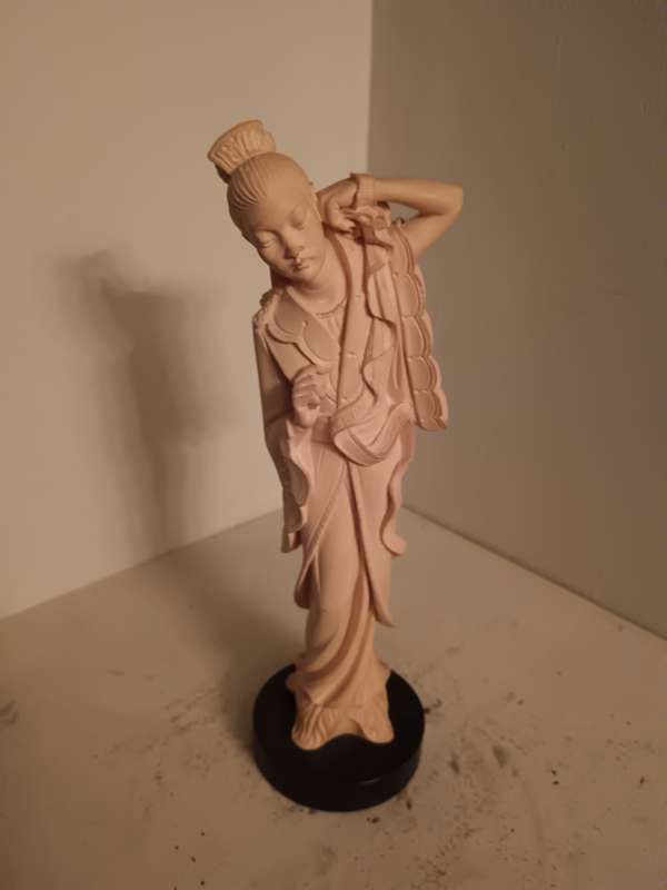 Asian Lady Figurine on a black Base