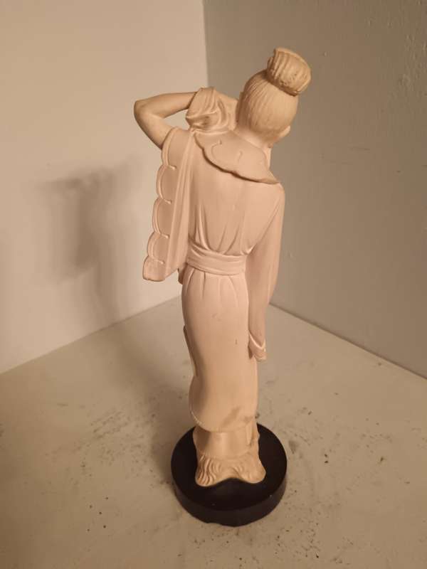 Asian Lady Figurine on a black Base