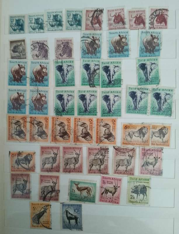 MIXED ALBUM STAMPS.RSA.RHODESIAS.BOTSWANA.AUSTRALIA.USA AND MORE SEE SCANS