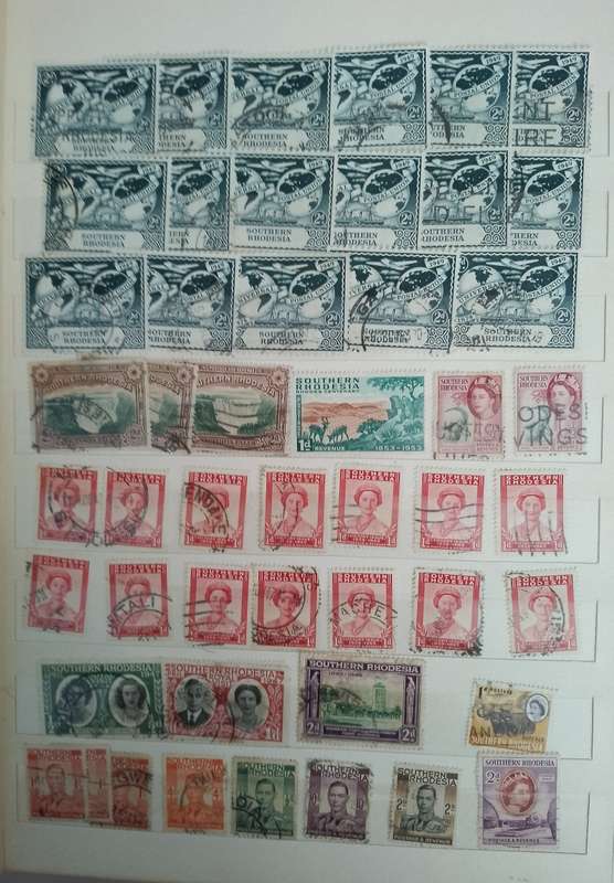 MIXED ALBUM STAMPS.RSA.RHODESIAS.BOTSWANA.AUSTRALIA.USA AND MORE SEE SCANS