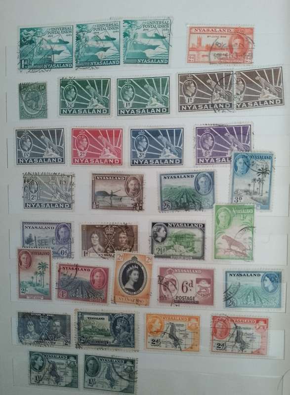 MIXED ALBUM STAMPS.RSA.RHODESIAS.BOTSWANA.AUSTRALIA.USA AND MORE SEE SCANS