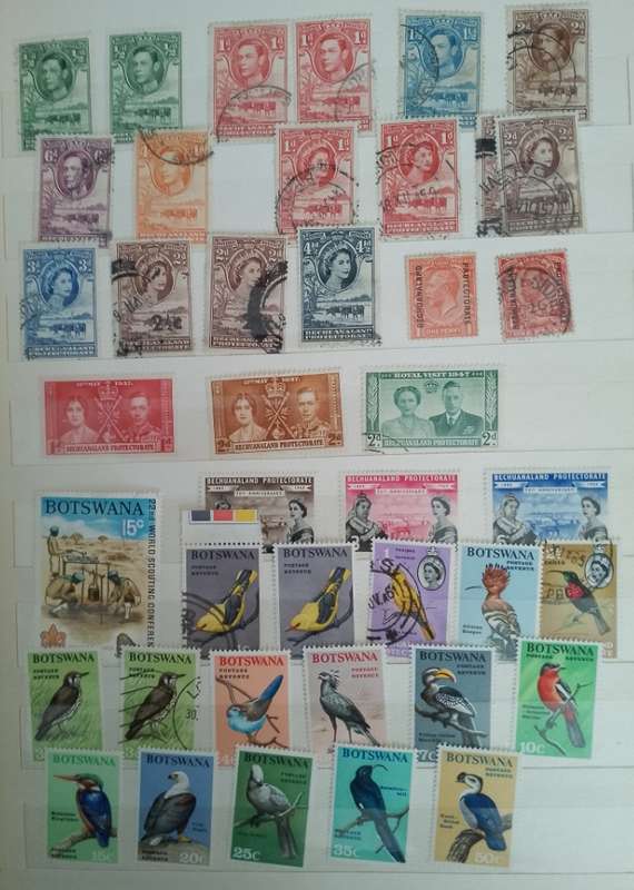 MIXED ALBUM STAMPS.RSA.RHODESIAS.BOTSWANA.AUSTRALIA.USA AND MORE SEE SCANS