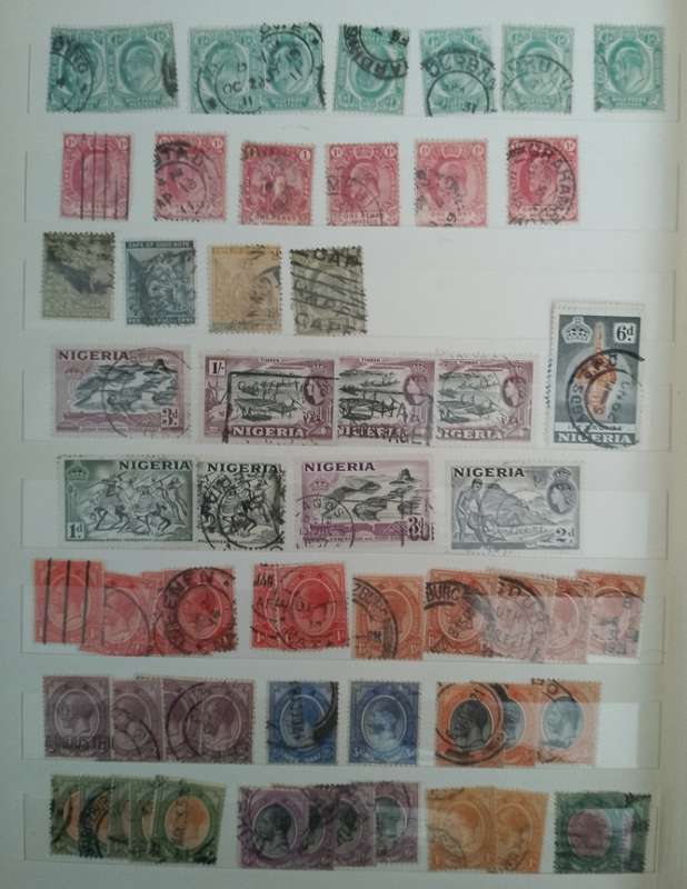 MIXED ALBUM STAMPS.RSA.RHODESIAS.BOTSWANA.AUSTRALIA.USA AND MORE SEE SCANS