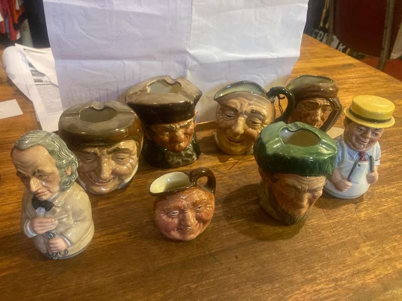 Collection of Royal Doulton character jugs , ashtrays and candle snufflers