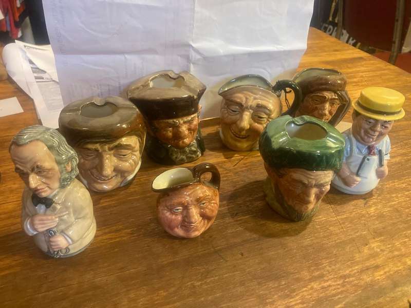 Collection of Royal Doulton character jugs , ashtrays and candle snufflers
