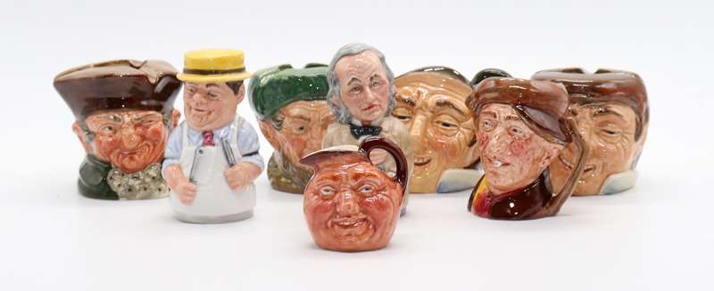 Collection of Royal Doulton character jugs , ashtrays and candle snufflers