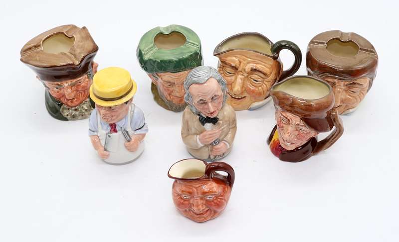 Collection of Royal Doulton character jugs , ashtrays and candle snufflers