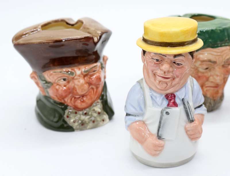 Collection of Royal Doulton character jugs , ashtrays and candle snufflers