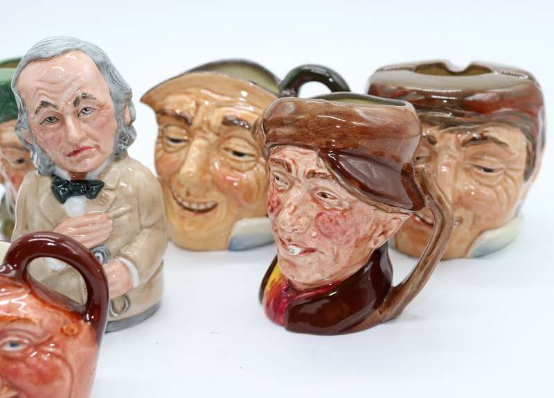 Collection of Royal Doulton character jugs , ashtrays and candle snufflers
