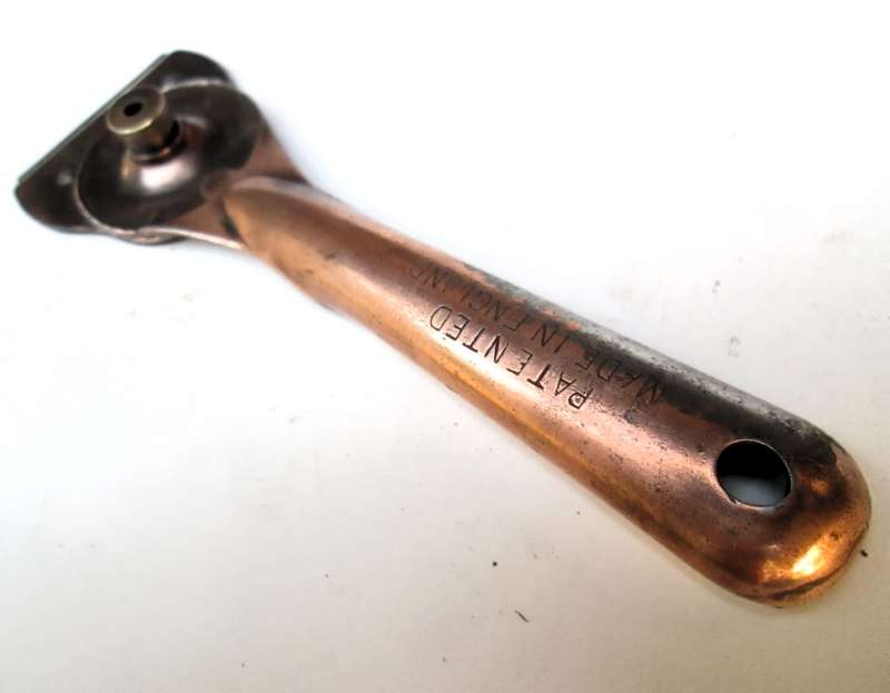 SCRAPER WITH AJUSTABLE HEAD