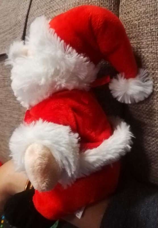 Plush Santa toy with satin bow. 24cm.