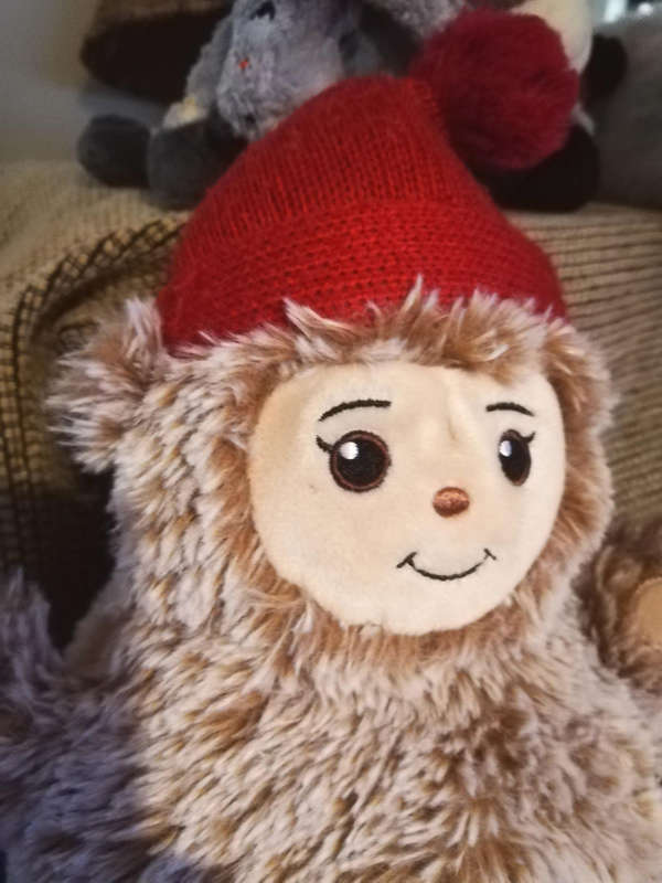 Adorable Plush Larry the Lavea Teddy Bear in Festive Red Hat - 30cm Cuddly Toy!