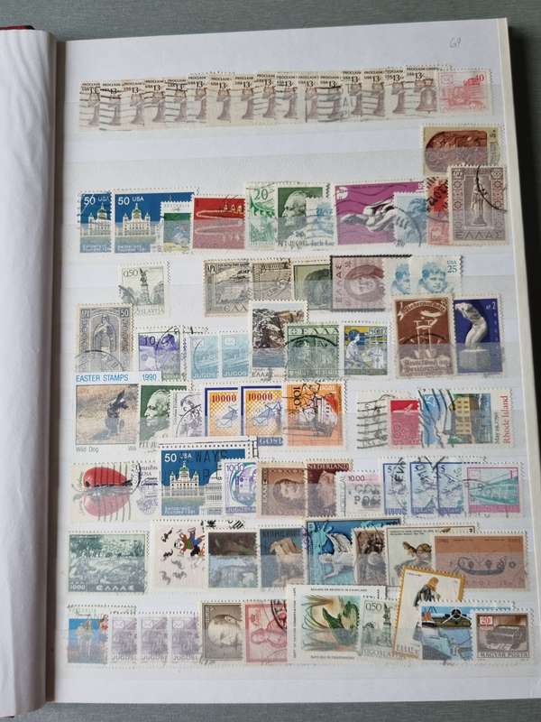 RED ALBUM 2ND HAND WITH MIXED WORLD STAMPS (MOSTLY USED). AS PER IMAGES. NB: PLEASE READ BELOW!!