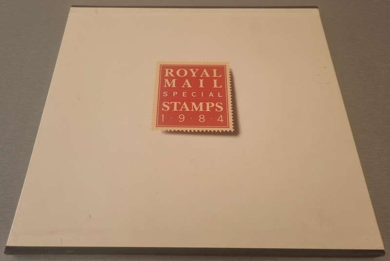 GB 1984 POST OFFICE YEAR BOOK IN 24 PAGE HARDBOUND BOOK WITH SLIP CASE. SG1236/71 CV GBP 85.