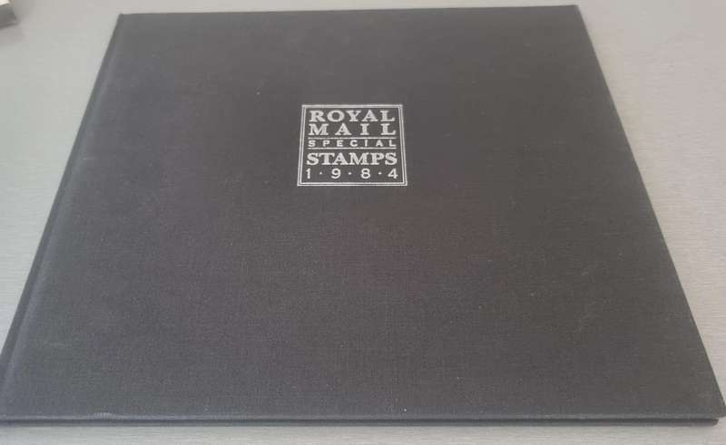 GB 1984 POST OFFICE YEAR BOOK IN 24 PAGE HARDBOUND BOOK WITH SLIP CASE. SG1236/71 CV GBP 85.