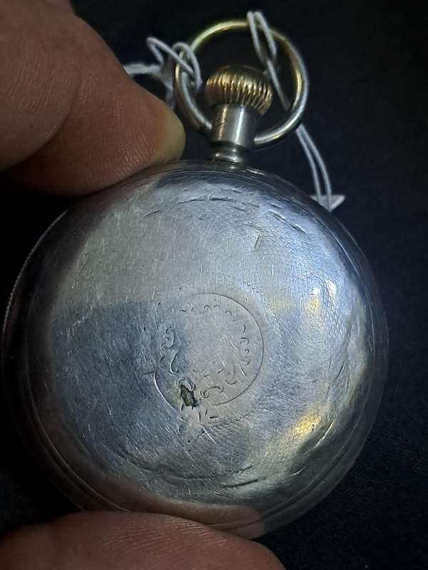 Silver Elgin pocket watch (no glass and runs and stops,back does not close)
