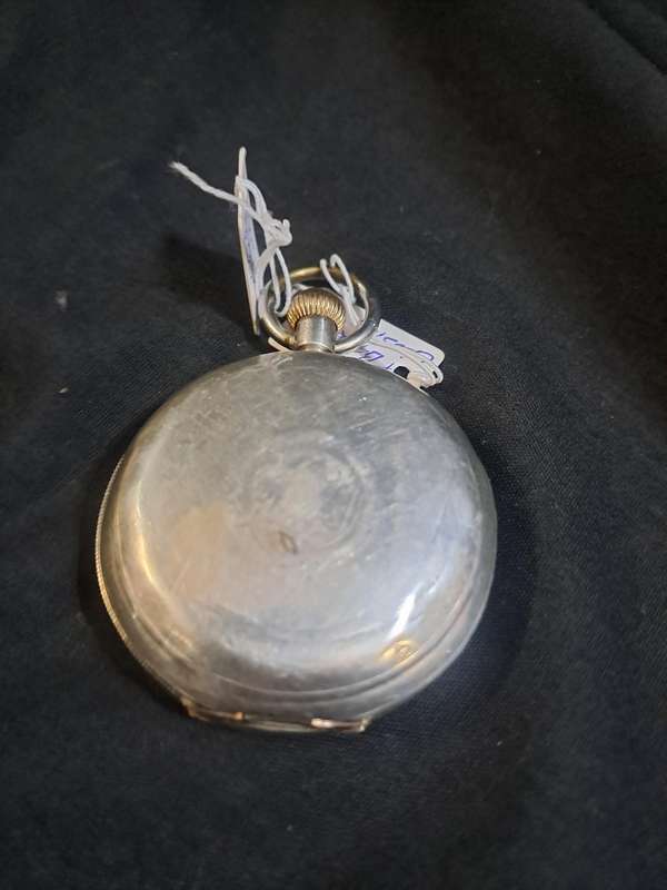 Silver Elgin pocket watch (no glass and runs and stops,back does not close)