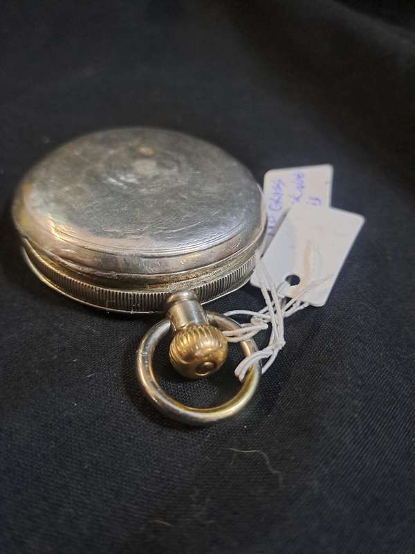 Silver Elgin pocket watch (no glass and runs and stops,back does not close)