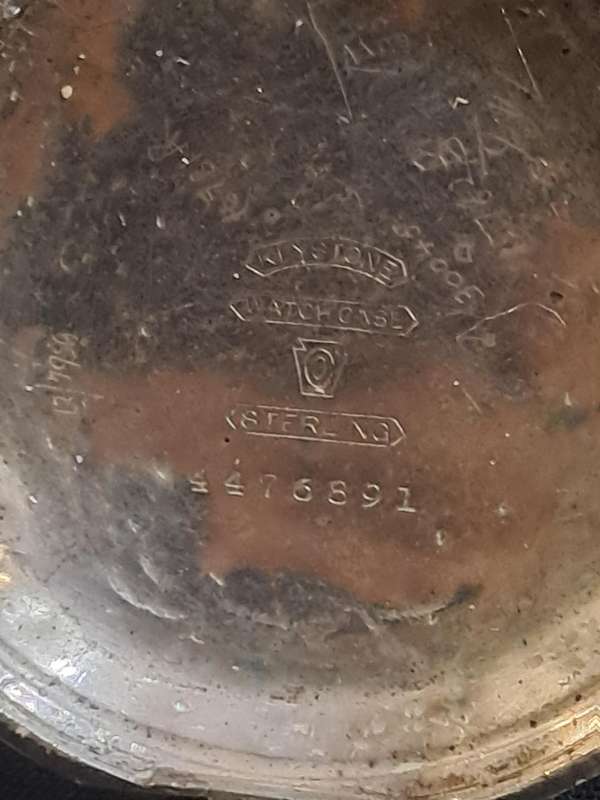 Silver Elgin pocket watch (no glass and runs and stops,back does not close)