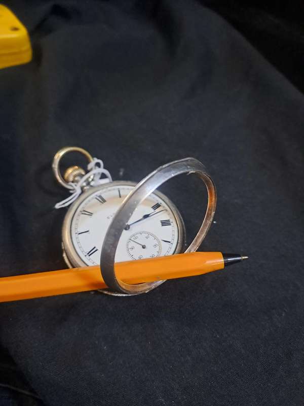 Silver Elgin pocket watch (no glass and runs and stops,back does not close)