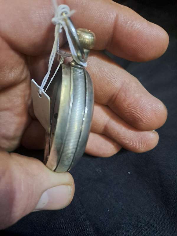 Silver Elgin pocket watch (no glass and runs and stops,back does not close)