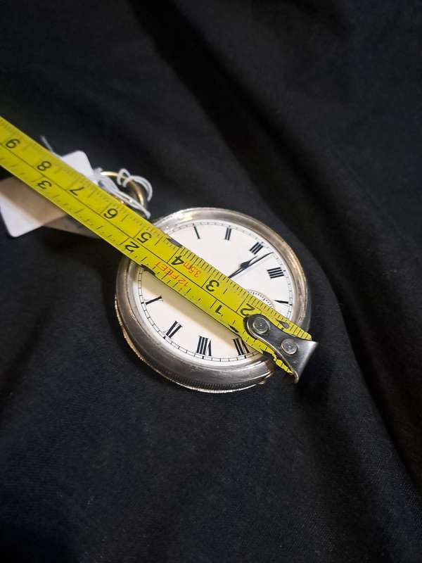 Silver Elgin pocket watch (no glass and runs and stops,back does not close)