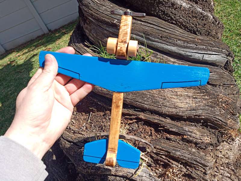 Dino Vintage style wooden toy aeroplane.