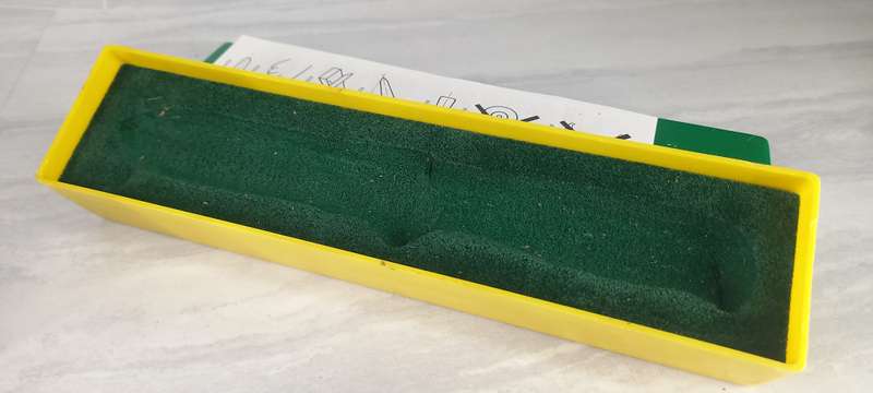 1980's vintage Puma knife yellow and green storage box.