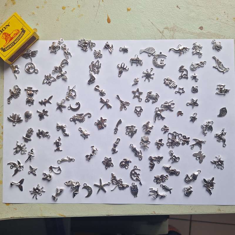 100 x silvery animal charms/pendants