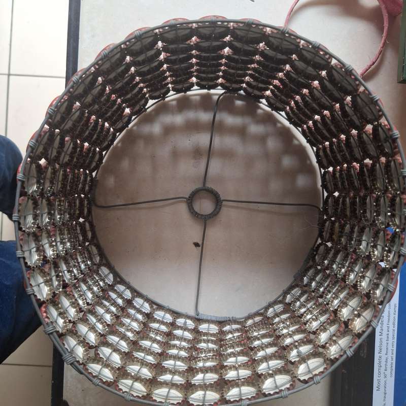 Lamp shade made from over 200 coca cola caps from 1999
