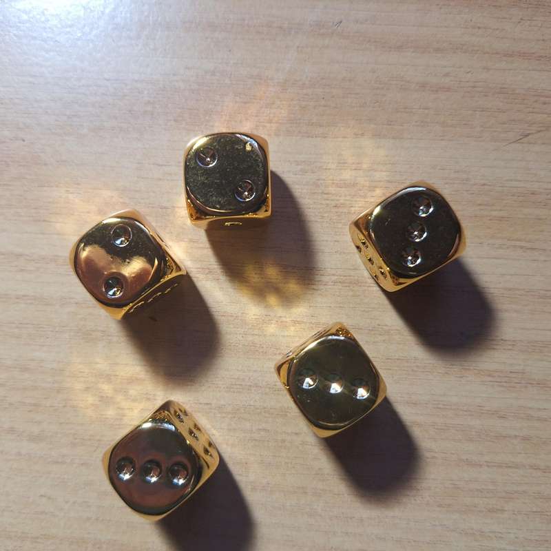 Set of 5 golden colored dice