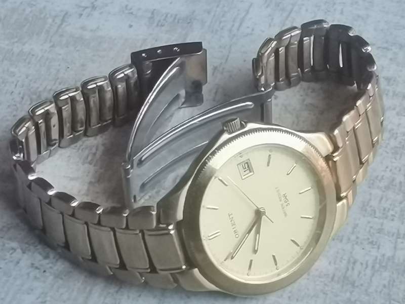 VINTAGE MENS ORIENT GOLD PLATED QUARTZ WATCH IN EXCELLENT WORKING CONDITION
