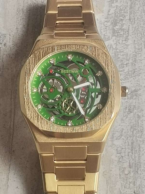BESTWIN MENS GOLD SKELETON WATCH IN EXCELLENT WORKING CONDITION