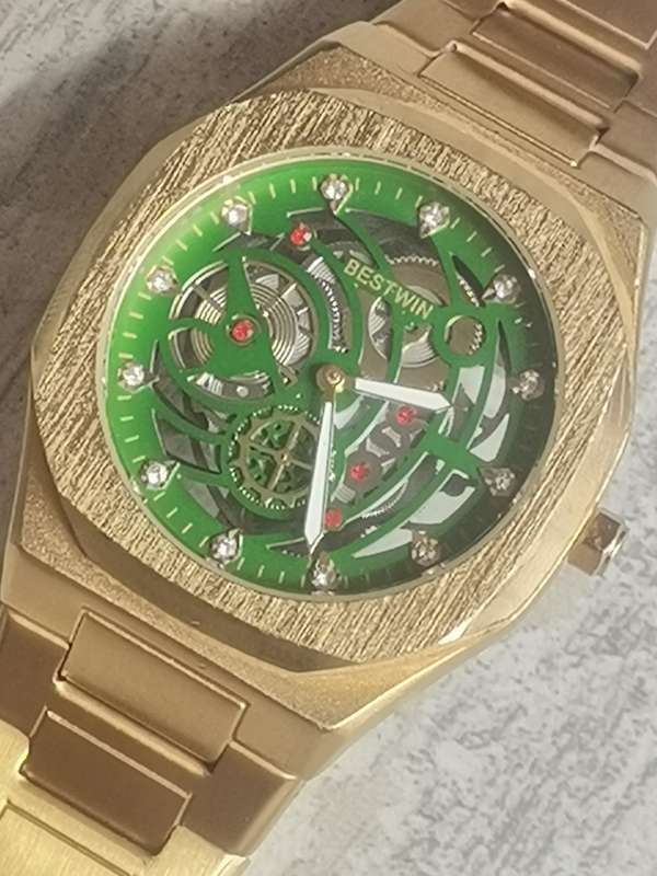 BESTWIN MENS GOLD SKELETON WATCH IN EXCELLENT WORKING CONDITION