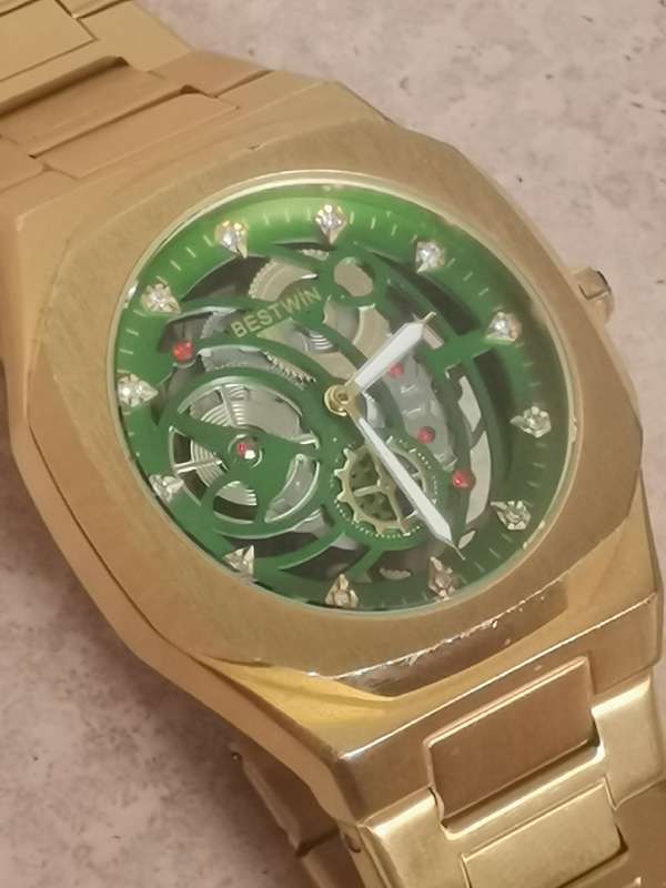 BESTWIN MENS GOLD SKELETON WATCH IN EXCELLENT WORKING CONDITION