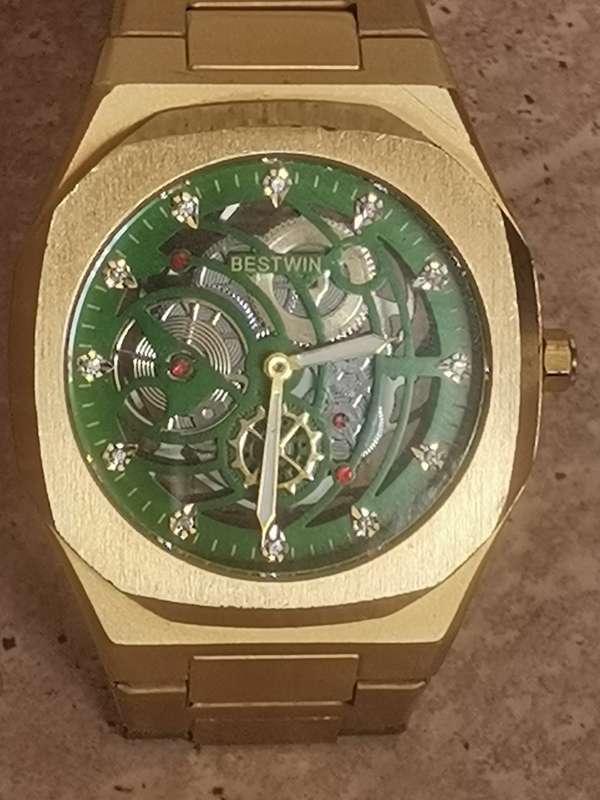 BESTWIN MENS GOLD SKELETON WATCH IN EXCELLENT WORKING CONDITION