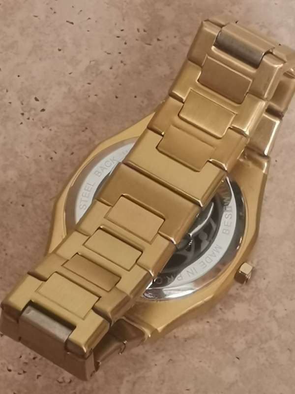 BESTWIN MENS GOLD SKELETON WATCH IN EXCELLENT WORKING CONDITION