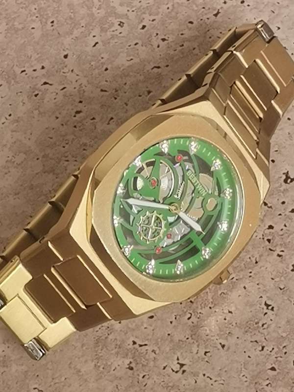 BESTWIN MENS GOLD SKELETON WATCH IN EXCELLENT WORKING CONDITION