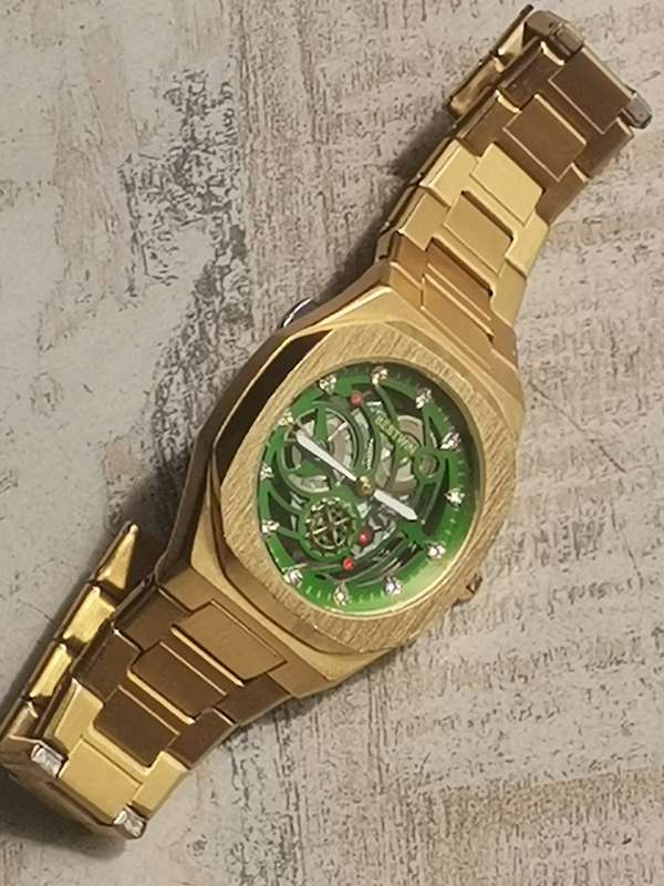 BESTWIN MENS GOLD SKELETON WATCH IN EXCELLENT WORKING CONDITION
