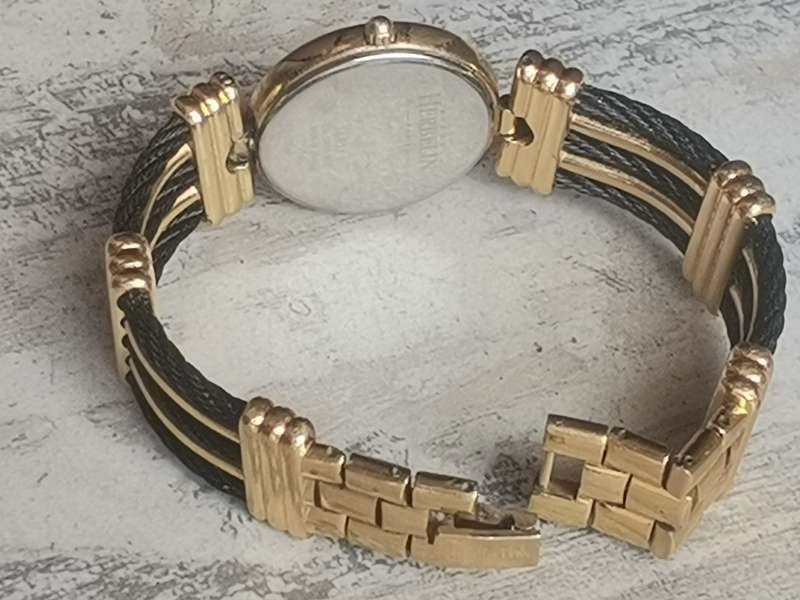 STUNNING LADIES MICHEL HERBELIN GOLD AND BLACK CABLE WATCH IN EXCL WORKING COND - VALUED OVER R15K