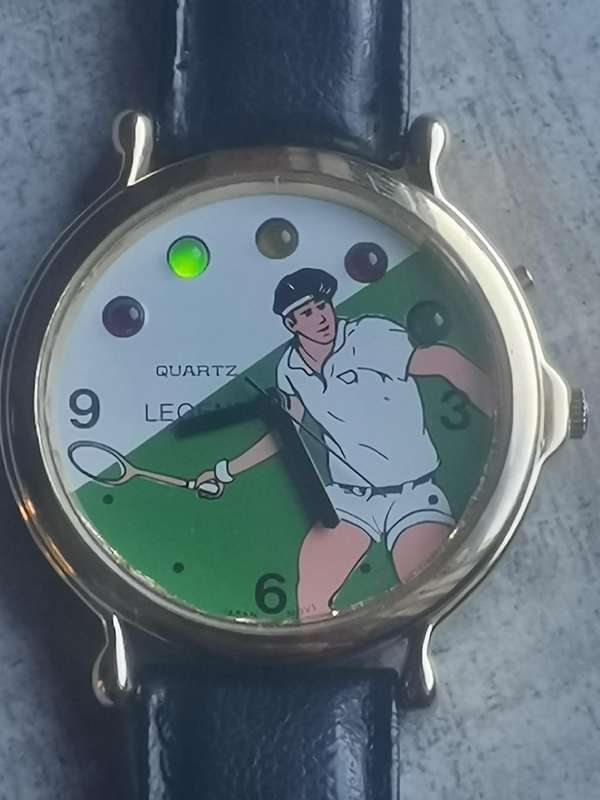 VINTAGE MENS LEGEND TENNIS WATCH WITH ROTATING COLOURFUL LIGHTS IN EXCELLENT WORKING CONDITION