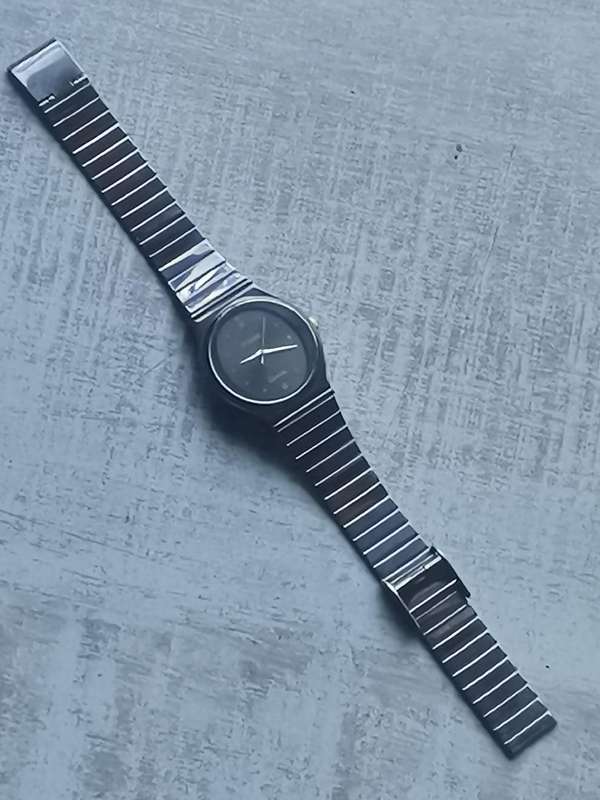 LADIES POISE ALL BLACK STAINLESS STEEL WATCH IN EXCELLENT WORKING CONDITION